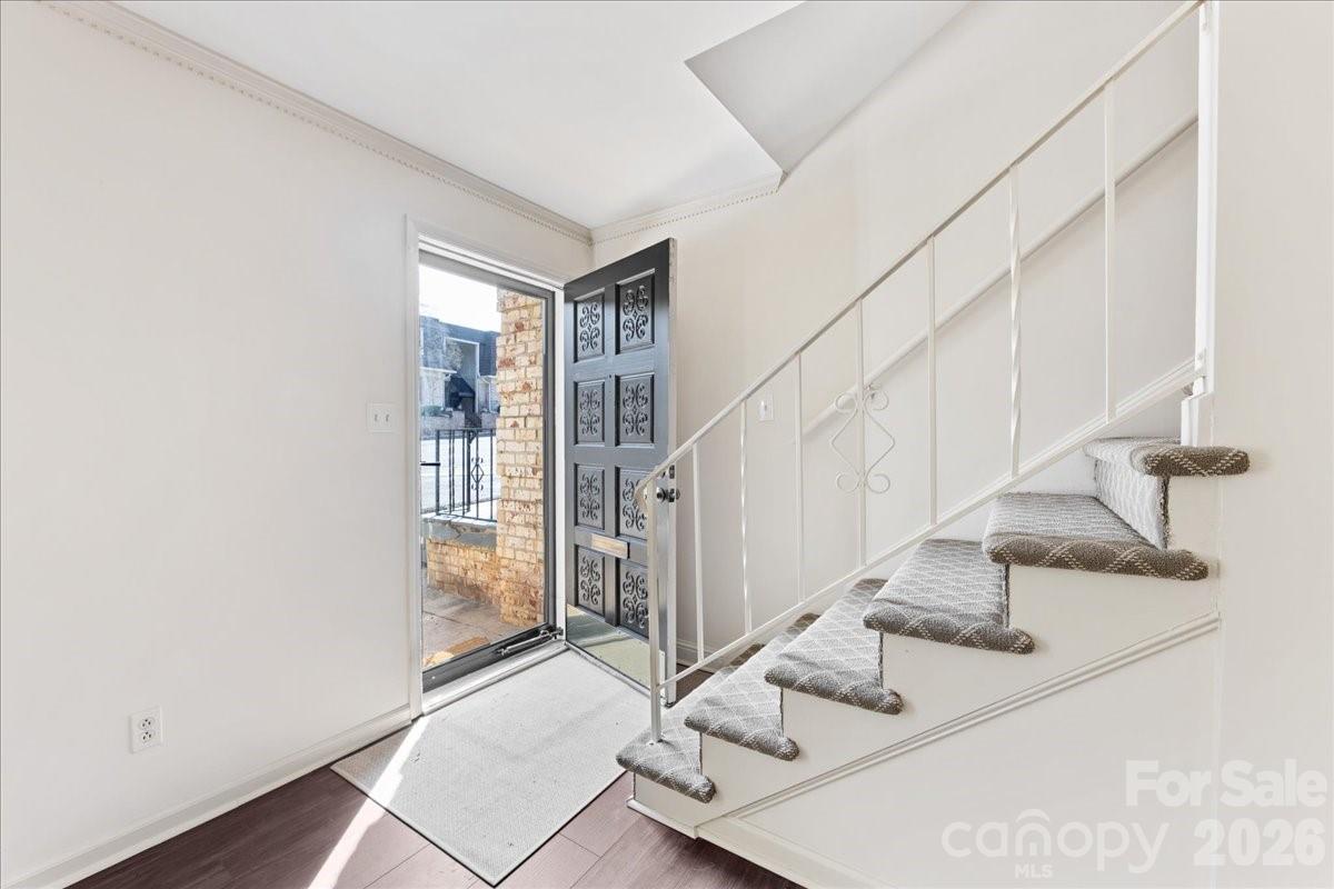 3500 Colony Road, Unit J Charlotte, NC 28211 - Photo 4 of 42 a view of entryway and hall with wooden floor