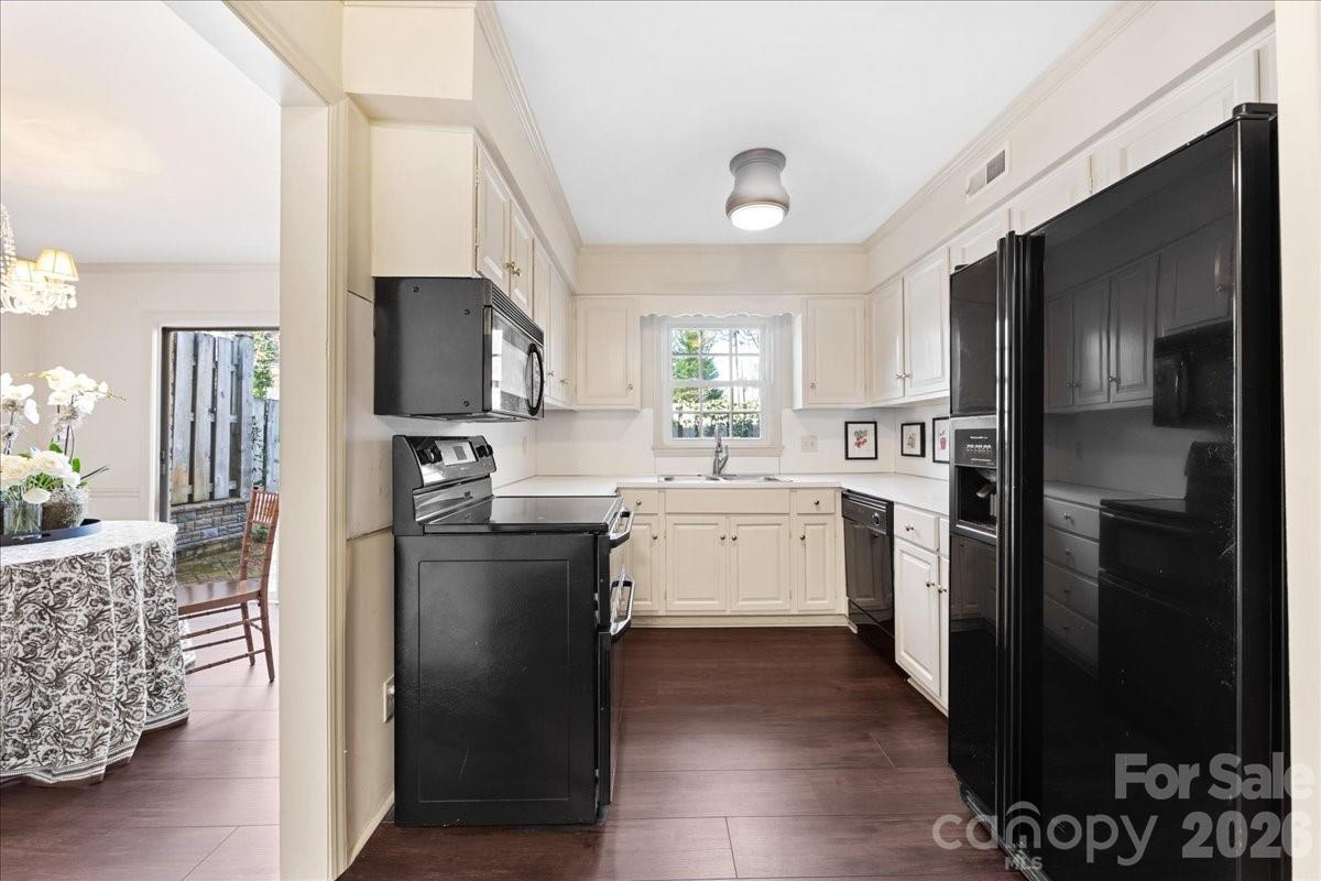 3500 Colony Road, Unit J Charlotte, NC 28211 - Photo 9 of 42 a kitchen with a refrigerator stove and sink