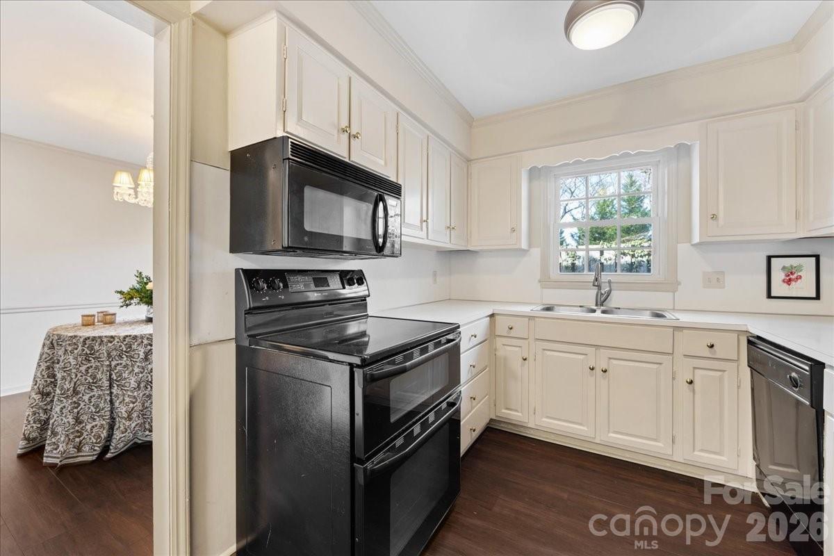 3500 Colony Road, Unit J Charlotte, NC 28211 - Photo 10 of 42 a kitchen with stainless steel appliances granite countertop a stove a sink and a microwave