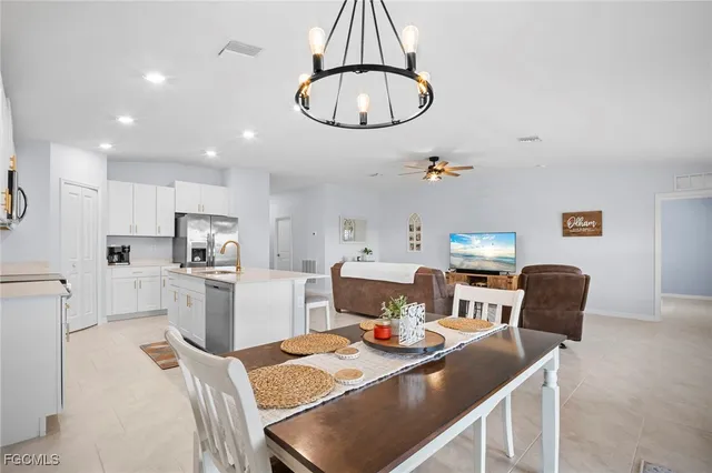 a view of kitchen and dining area with furniture