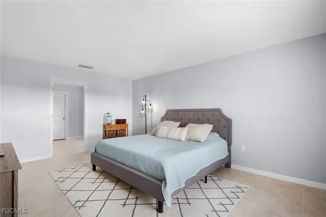 a bedroom with a bed and a table