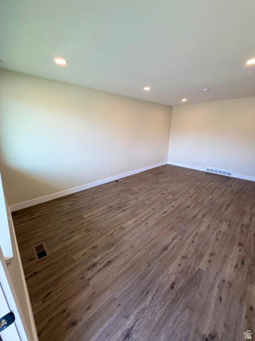 450 13800 South, Unit 2 Draper, UT 84020 - Photo 11 of 21 Spacious room featuring wood-finish flooring, recessed lighting, neutral paint, and white baseboards