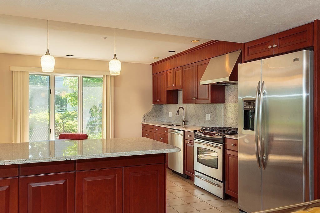 39 Beverly Road Arlington, MA 02474 - Photo 14 of 37 a kitchen with a sink a stove and refrigerator