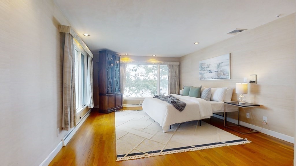 39 Beverly Road Arlington, MA 02474 - Photo 18 of 37 a spacious bedroom with a bed and a window