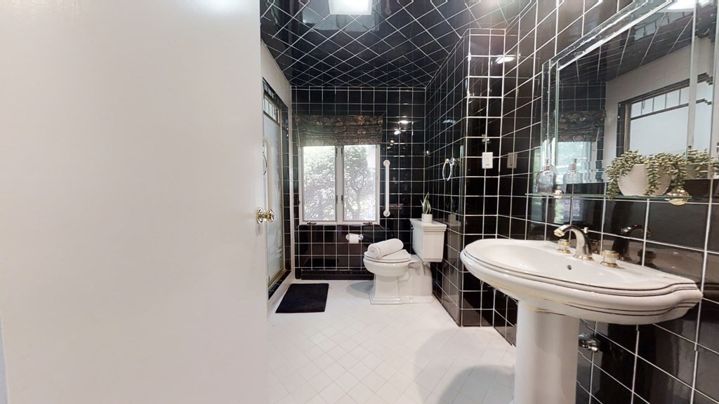 39 Beverly Road Arlington, MA 02474 - Photo 20 of 37 a bathroom with a sink toilet and shower