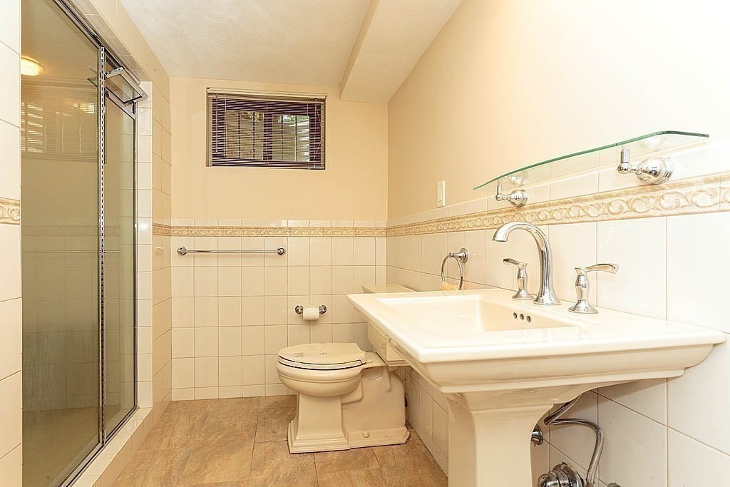 39 Beverly Road Arlington, MA 02474 - Photo 22 of 37 a bathroom with a sink toilet and shower