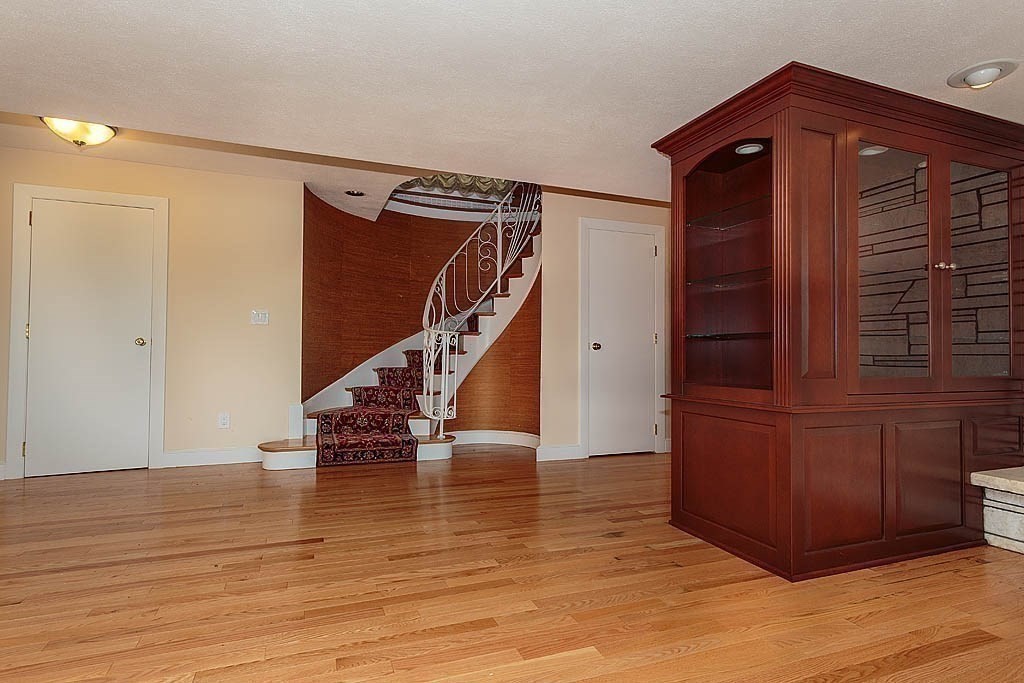 39 Beverly Road Arlington, MA 02474 - Photo 24 of 37 a view of a hallway with wooden floor and staircase