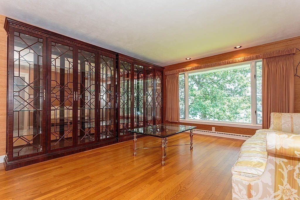 39 Beverly Road Arlington, MA 02474 - Photo 25 of 37 a view of room with floor to ceiling window and wooden floor
