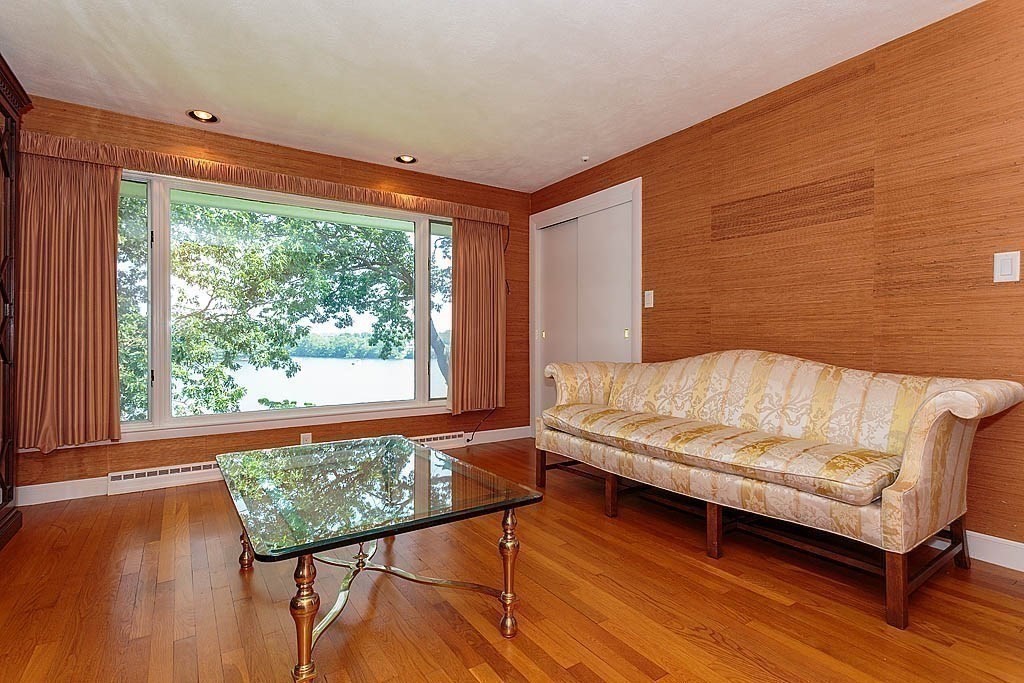39 Beverly Road Arlington, MA 02474 - Photo 26 of 37 a bedroom with a bed and wooden floor