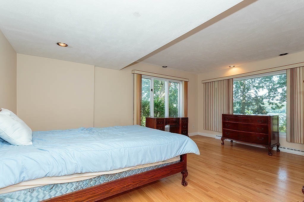 39 Beverly Road Arlington, MA 02474 - Photo 27 of 37 a bedroom with a bed and a large window