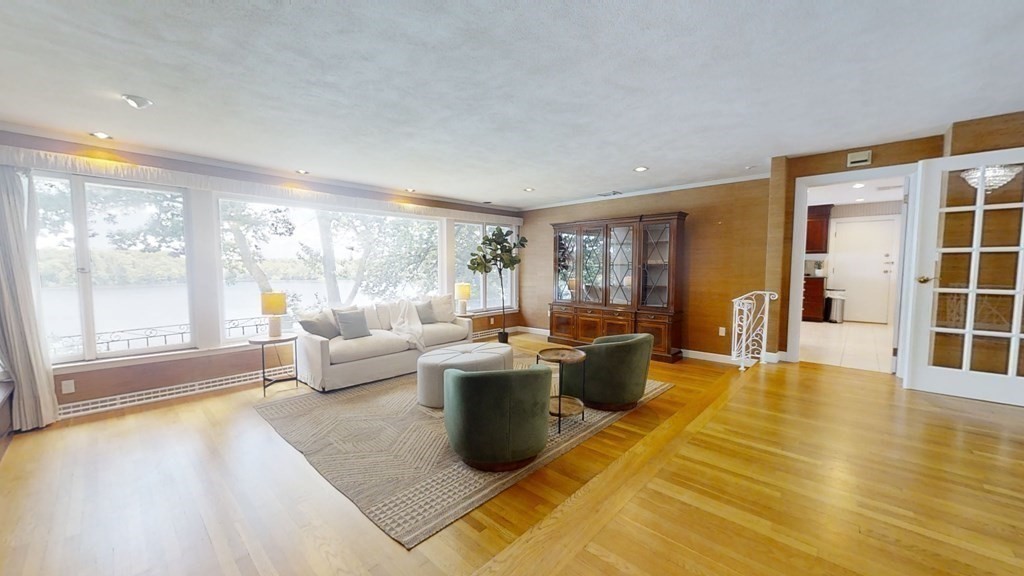 39 Beverly Road Arlington, MA 02474 - Photo 7 of 37 a living room with a large window and a table
