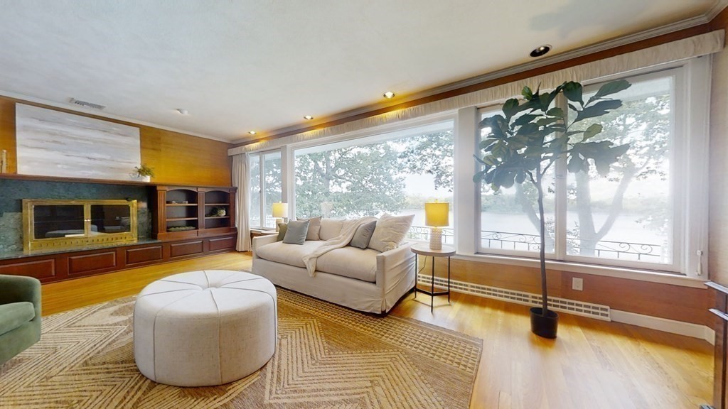 39 Beverly Road Arlington, MA 02474 - Photo 8 of 37 a living room with furniture and a flat screen tv