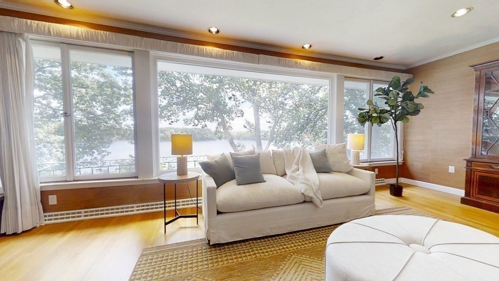 39 Beverly Road Arlington, MA 02474 - Photo 9 of 37 a living room with furniture and a large window