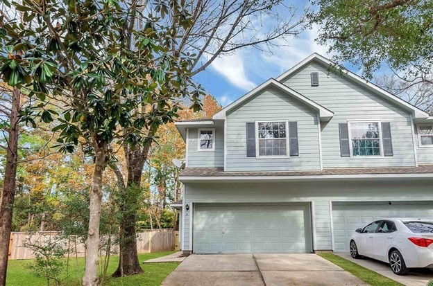 2 Peach Ridge Place The Woodlands, TX 77382 - Photo 1 of 29 a car parked in front of white house