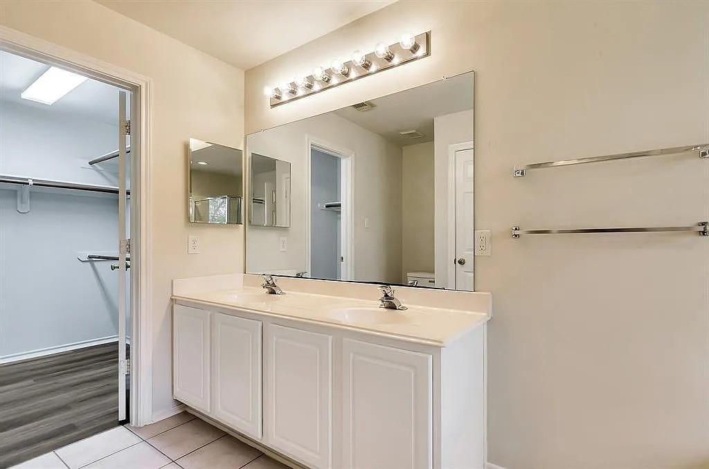 2 Peach Ridge Place The Woodlands, TX 77382 - Photo 12 of 29 a bathroom with a sink and a mirror