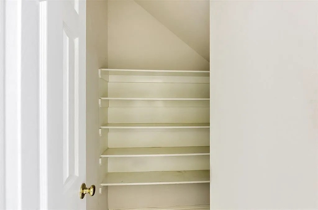 2 Peach Ridge Place The Woodlands, TX 77382 - Photo 15 of 29 a view of an empty walk in closet