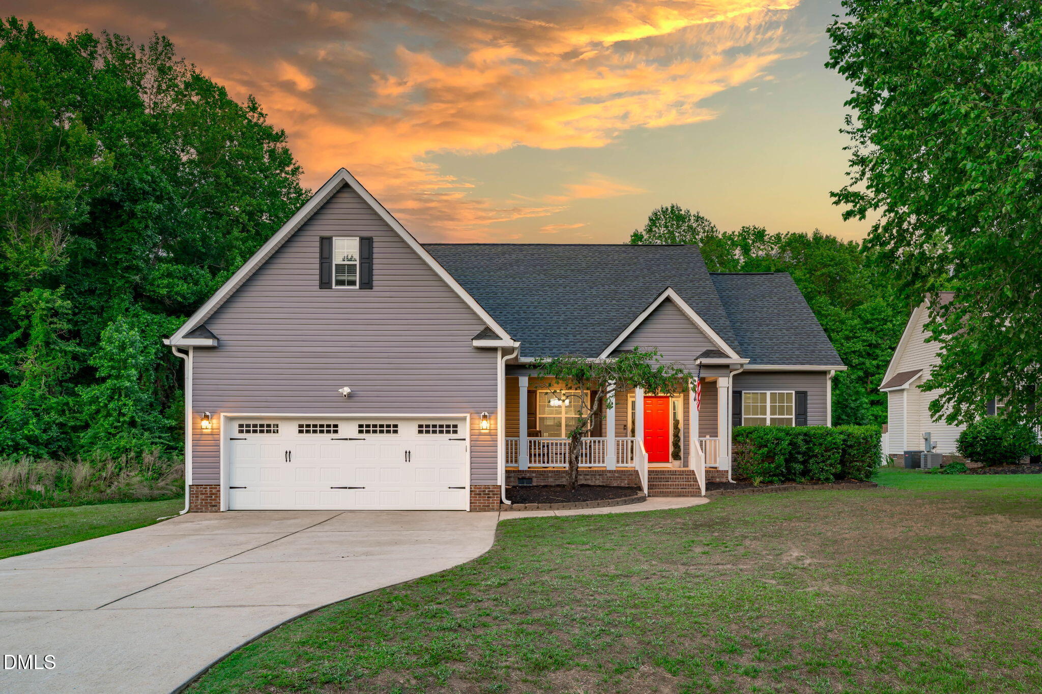 2450 Rolling Tracks Road Willow Spring, NC 27592 - Photo 2 of 64 a view of house with backyard and garden