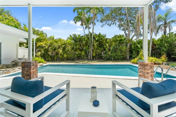 a view of a swimming pool with a patio