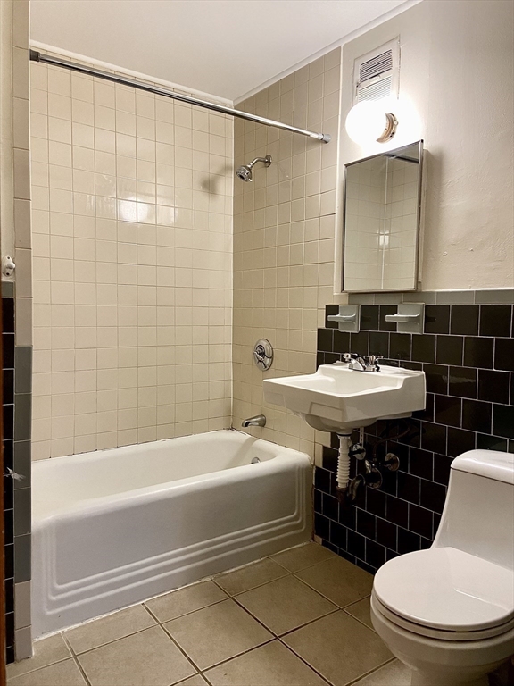 257 Beacon Street, Unit 3 Somerville, MA 02143 - Photo 13 of 15 a bathroom with a sink a toilet and shower