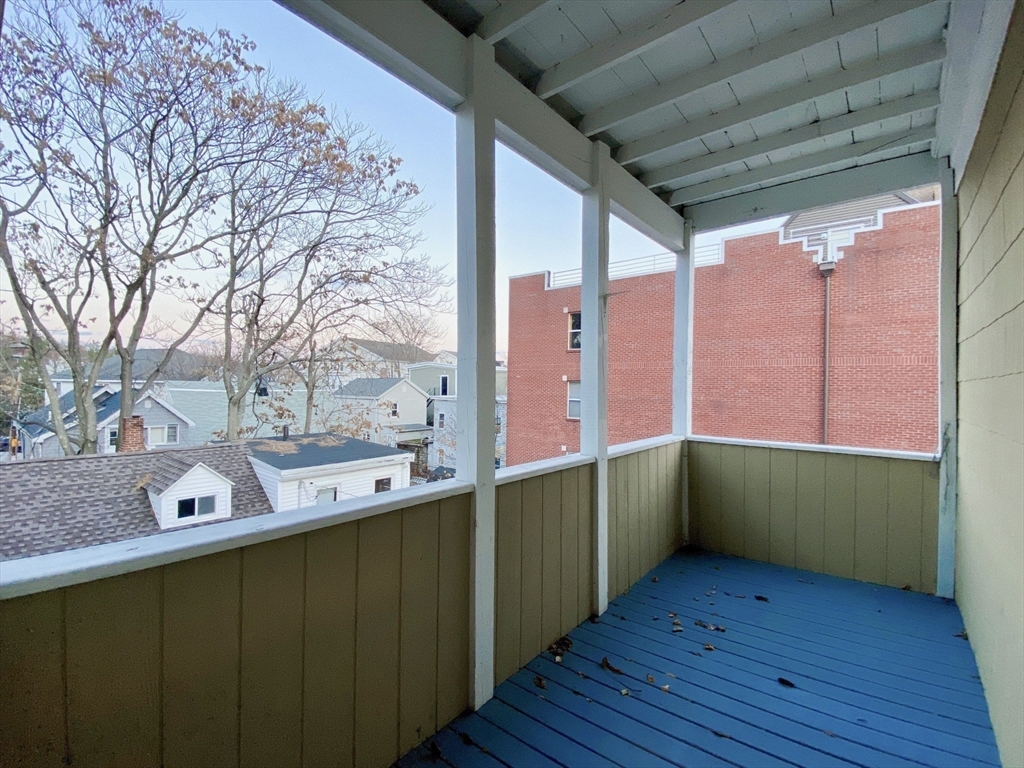 257 Beacon Street, Unit 3 Somerville, MA 02143 - Photo 14 of 15 a room with trees and wooden floors