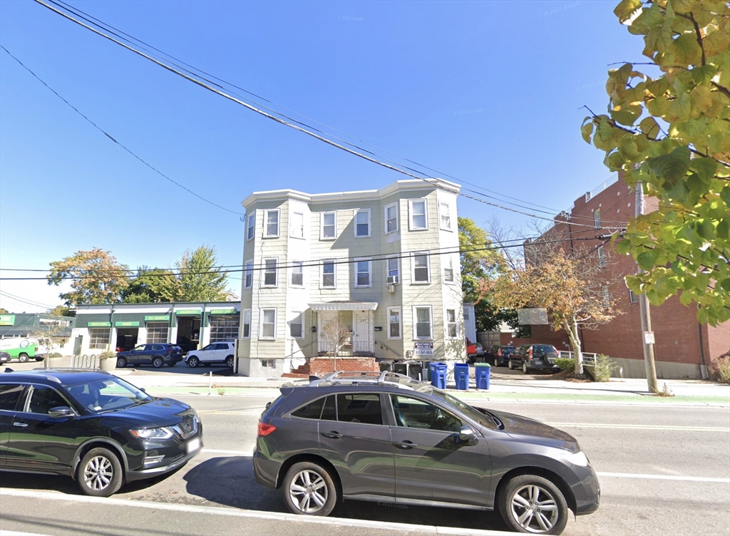 257 Beacon Street, Unit 3 Somerville, MA 02143 - Photo 15 of 15 a front view of a house with parking space