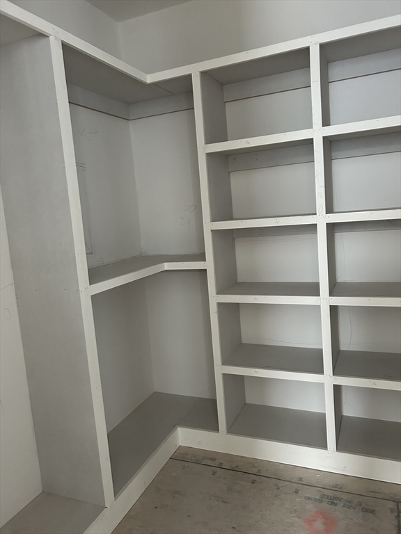 34 West Street, Unit B Newton, MA 02458 - Photo 12 of 17 a view of walk in closet with empty racks