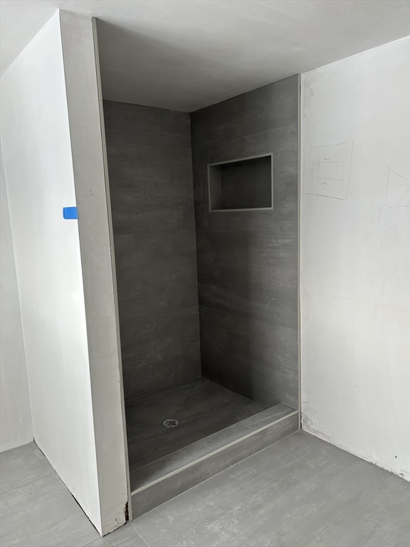 34 West Street, Unit B Newton, MA 02458 - Photo 13 of 17 a bathroom with a glass shower door