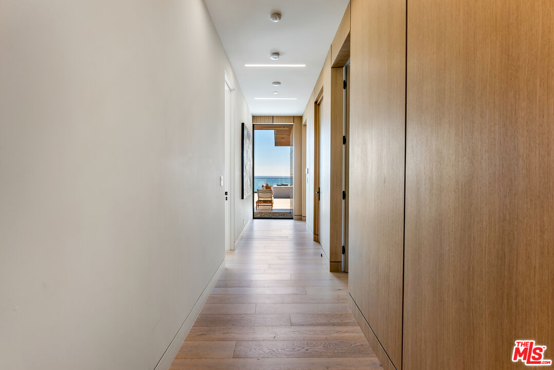 23917 Malibu Road Malibu, CA 90265 - Photo 26 of 62 a view of a hallway with wooden floor
