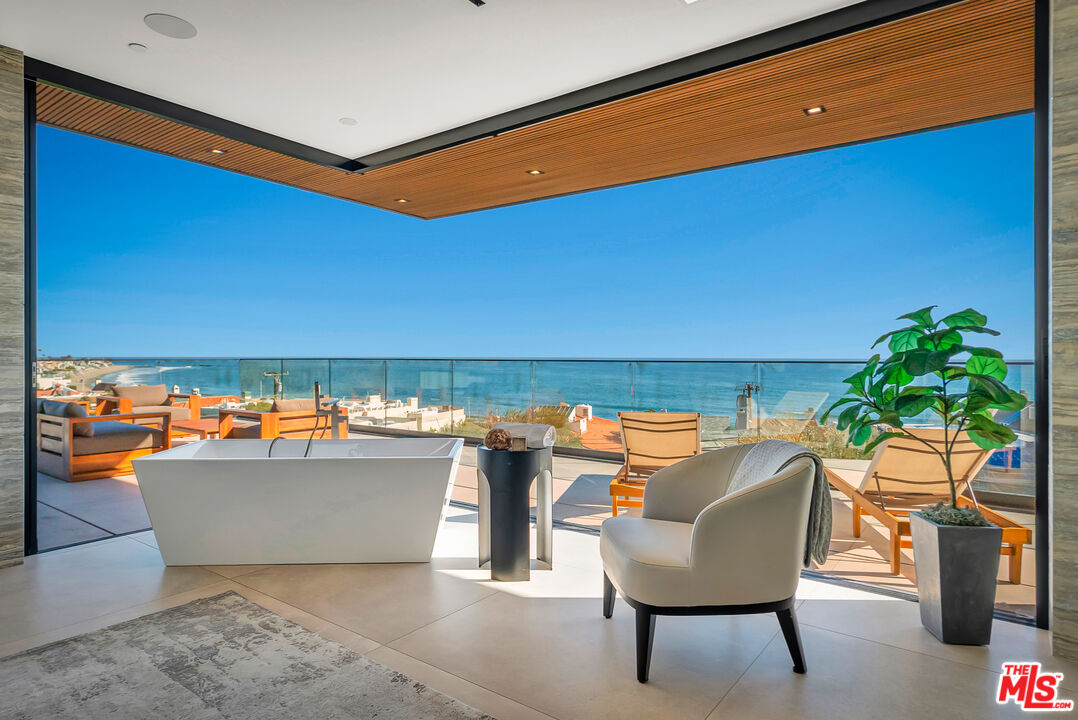 23917 Malibu Road Malibu, CA 90265 - Photo 32 of 62 a view of a chairs and table in patio