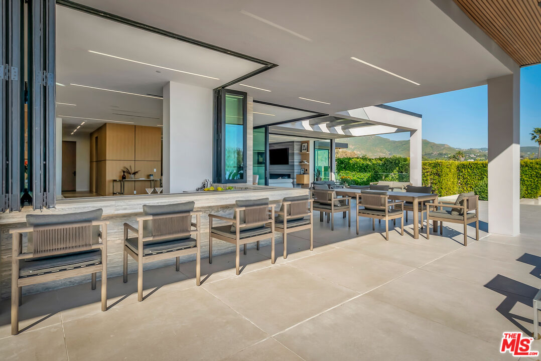 23917 Malibu Road Malibu, CA 90265 - Photo 55 of 62 a view of a dining room with furniture window and outside view
