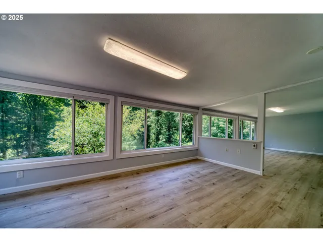 a view of room with window and hardwood floor
