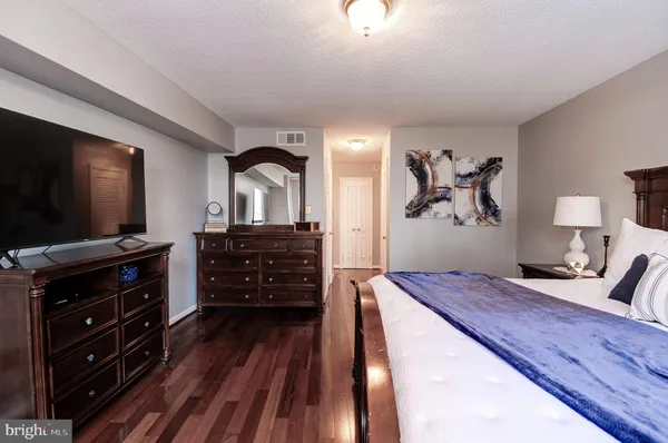 a living room with furniture and flat screen tv