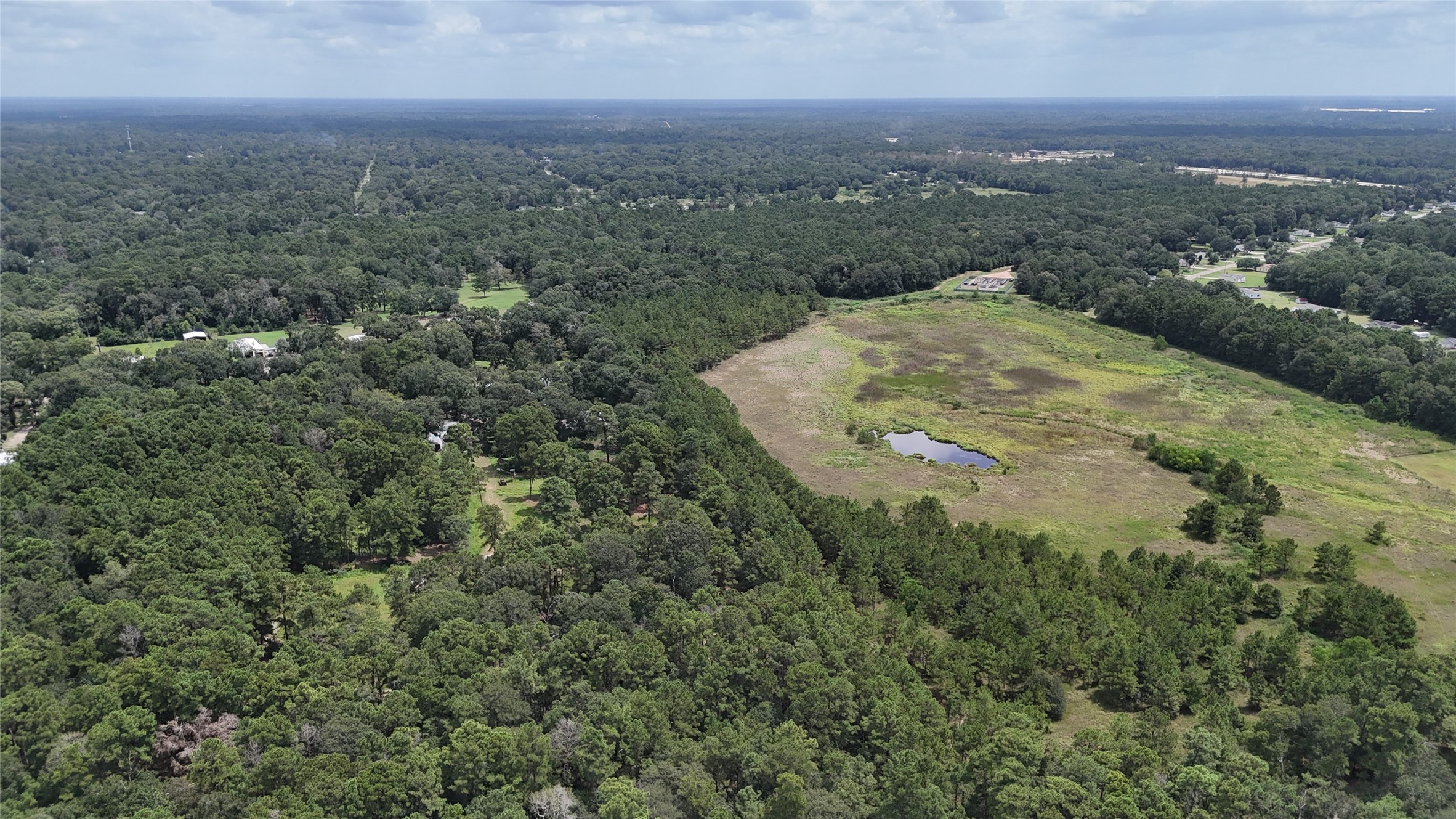 15455 Sharon Lane Conroe, TX 77302 - Photo 3 of 9 an aerial view of residential houses with outdoor space