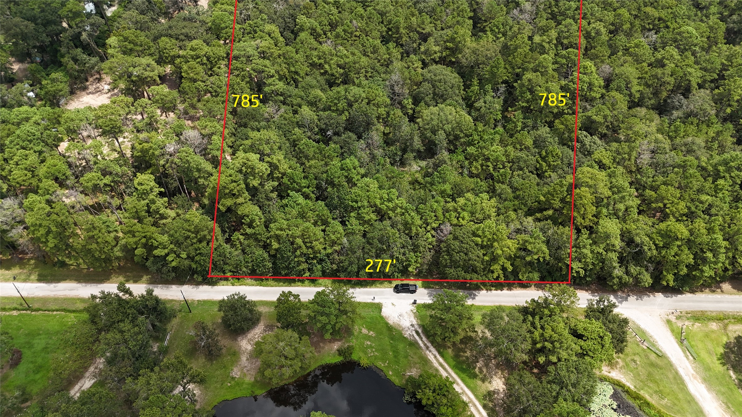 15455 Sharon Lane Conroe, TX 77302 - Photo 8 of 9 a view of a yard