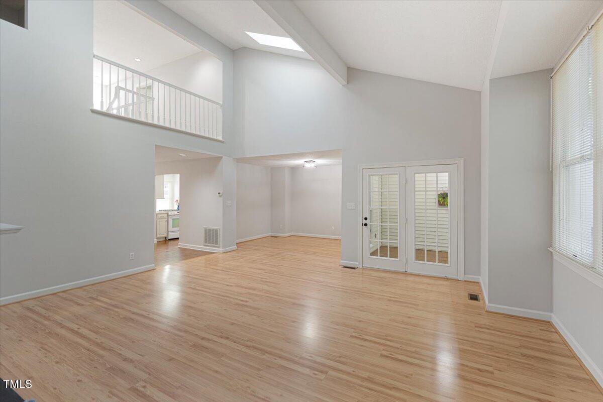 411 Brampton Close Pittsboro, NC 27312 - Photo 10 of 71 a view of an empty room with wooden floor