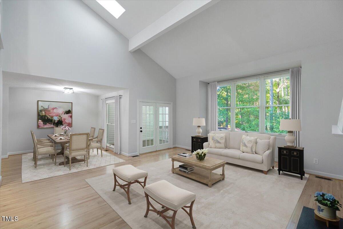 411 Brampton Close Pittsboro, NC 27312 - Photo 11 of 71 a living room with furniture and a large window