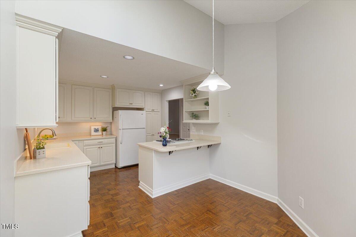 411 Brampton Close Pittsboro, NC 27312 - Photo 18 of 71 a kitchen with a sink stainless steel appliances and cabinets