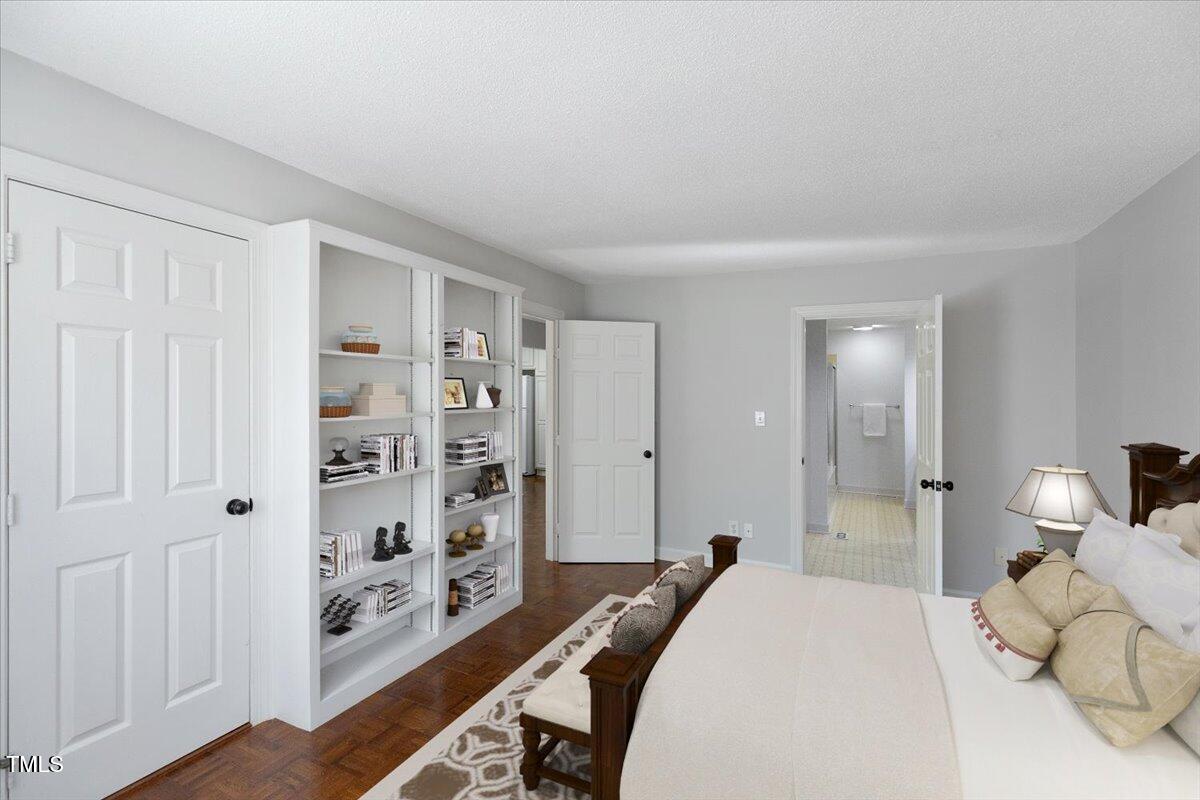 411 Brampton Close Pittsboro, NC 27312 - Photo 23 of 71 a bed room with a bed and a cabinets