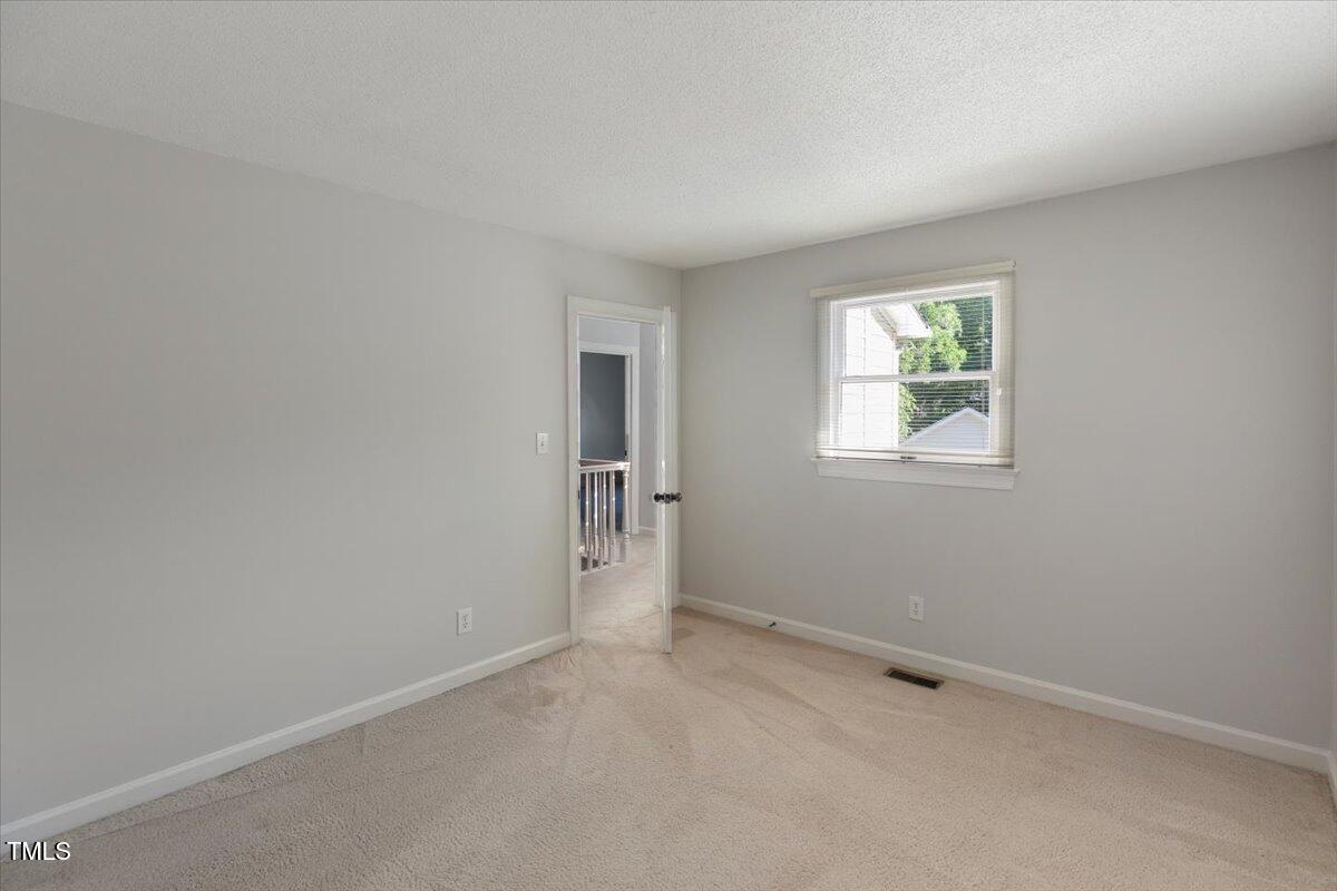 411 Brampton Close Pittsboro, NC 27312 - Photo 33 of 71 an empty room with windows