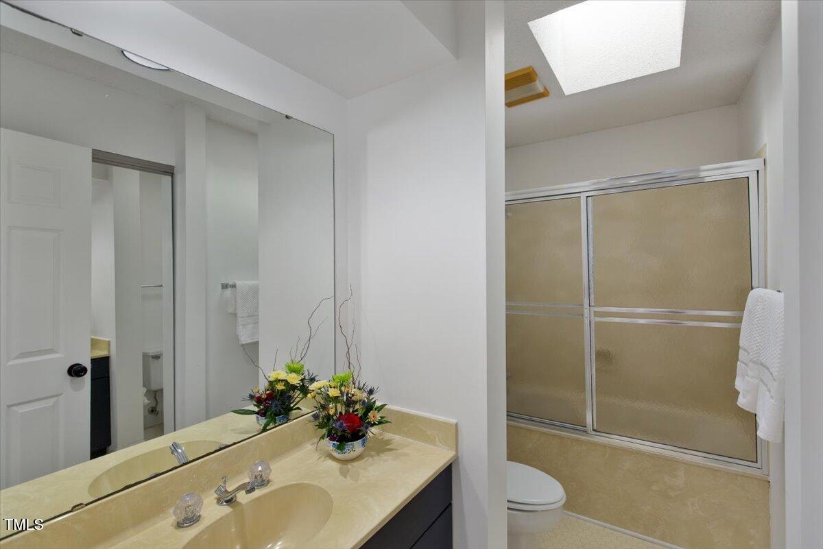 411 Brampton Close Pittsboro, NC 27312 - Photo 35 of 71 a bathroom with a sink toilet and shower