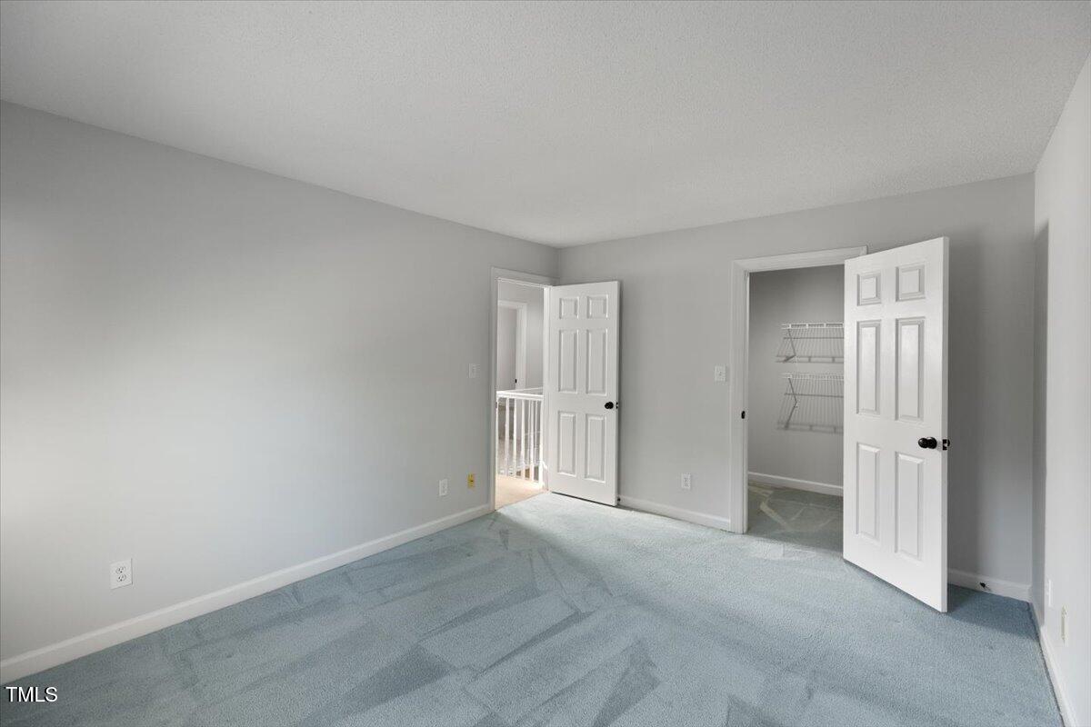 411 Brampton Close Pittsboro, NC 27312 - Photo 37 of 71 a view of an empty room and closet area