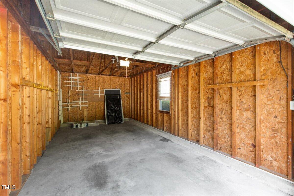 411 Brampton Close Pittsboro, NC 27312 - Photo 46 of 71 a view of empty room with wooden walls