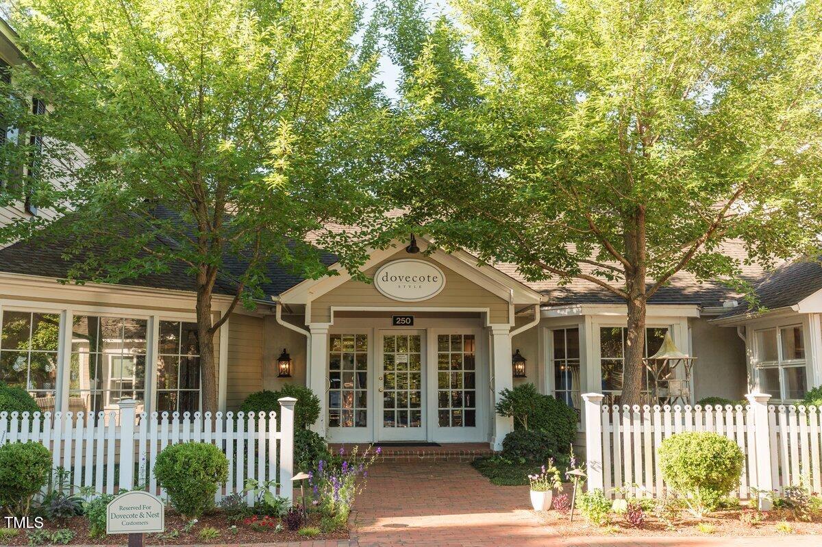 411 Brampton Close Pittsboro, NC 27312 - Photo 61 of 71 a front view of a house with a garden
