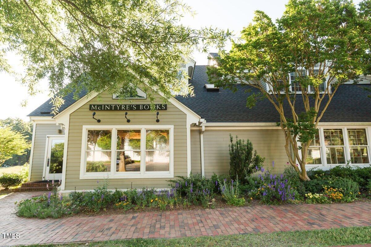 411 Brampton Close Pittsboro, NC 27312 - Photo 62 of 71 a front view of a house with garden