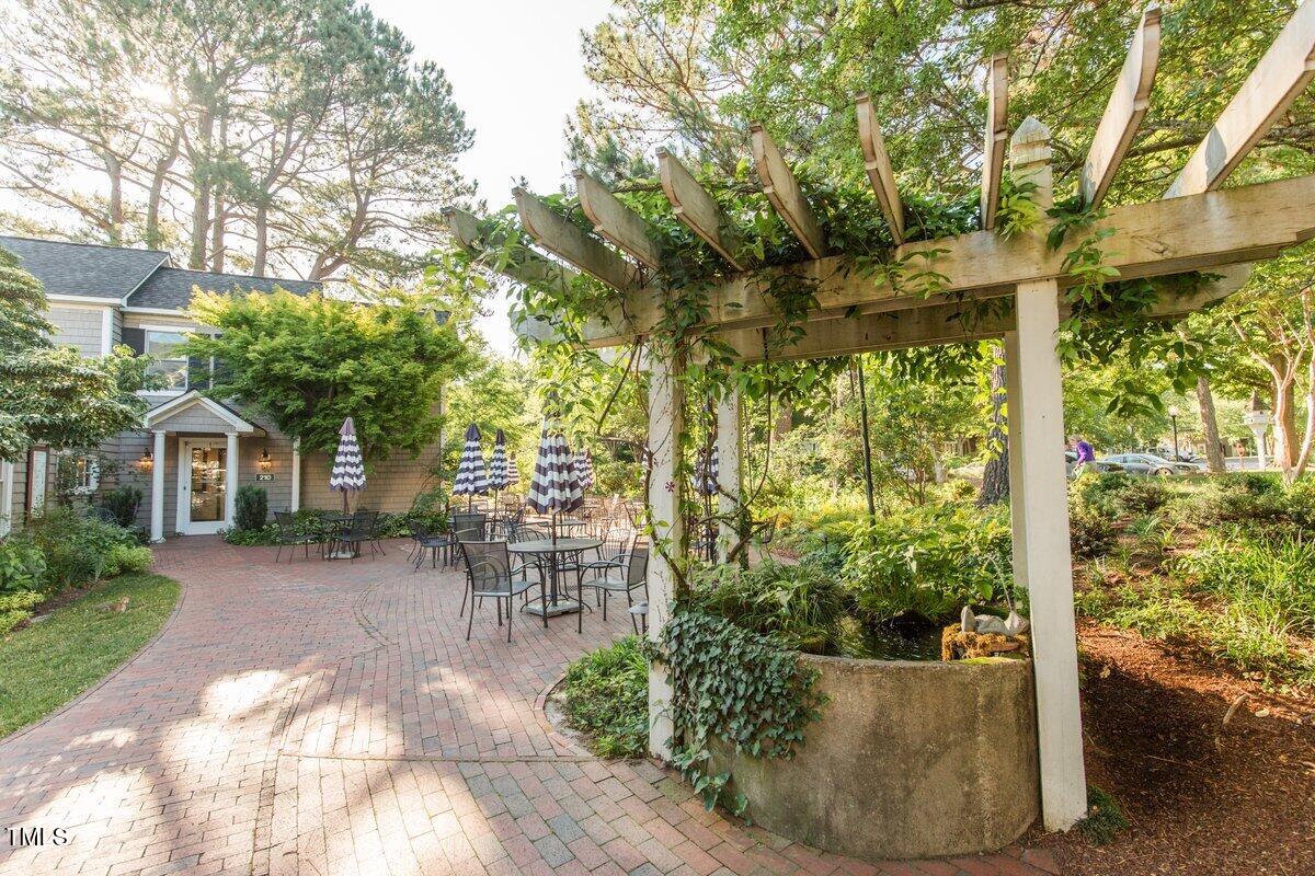 411 Brampton Close Pittsboro, NC 27312 - Photo 63 of 71 a view of a patio with table and chairs and potted plants