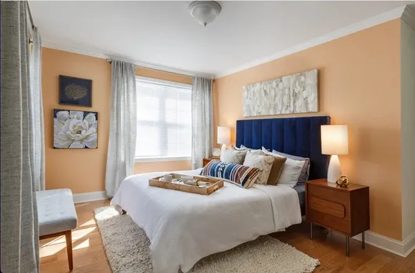 a bedroom with a bed and window