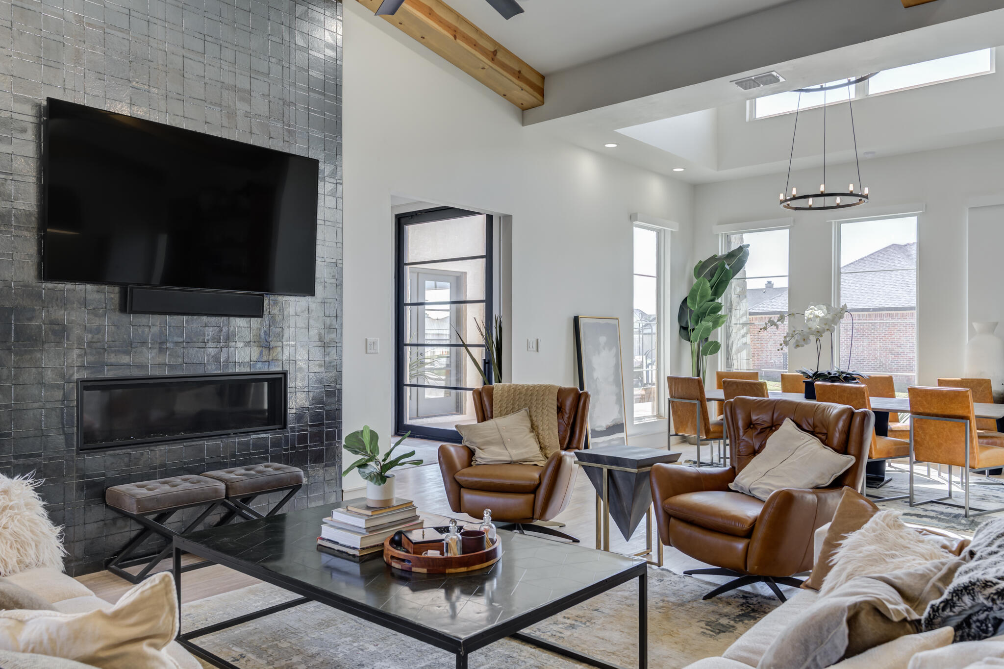 3940 148th Street Lubbock, TX 79423 - Photo 16 of 92 a living room with furniture a flat screen tv and a fireplace