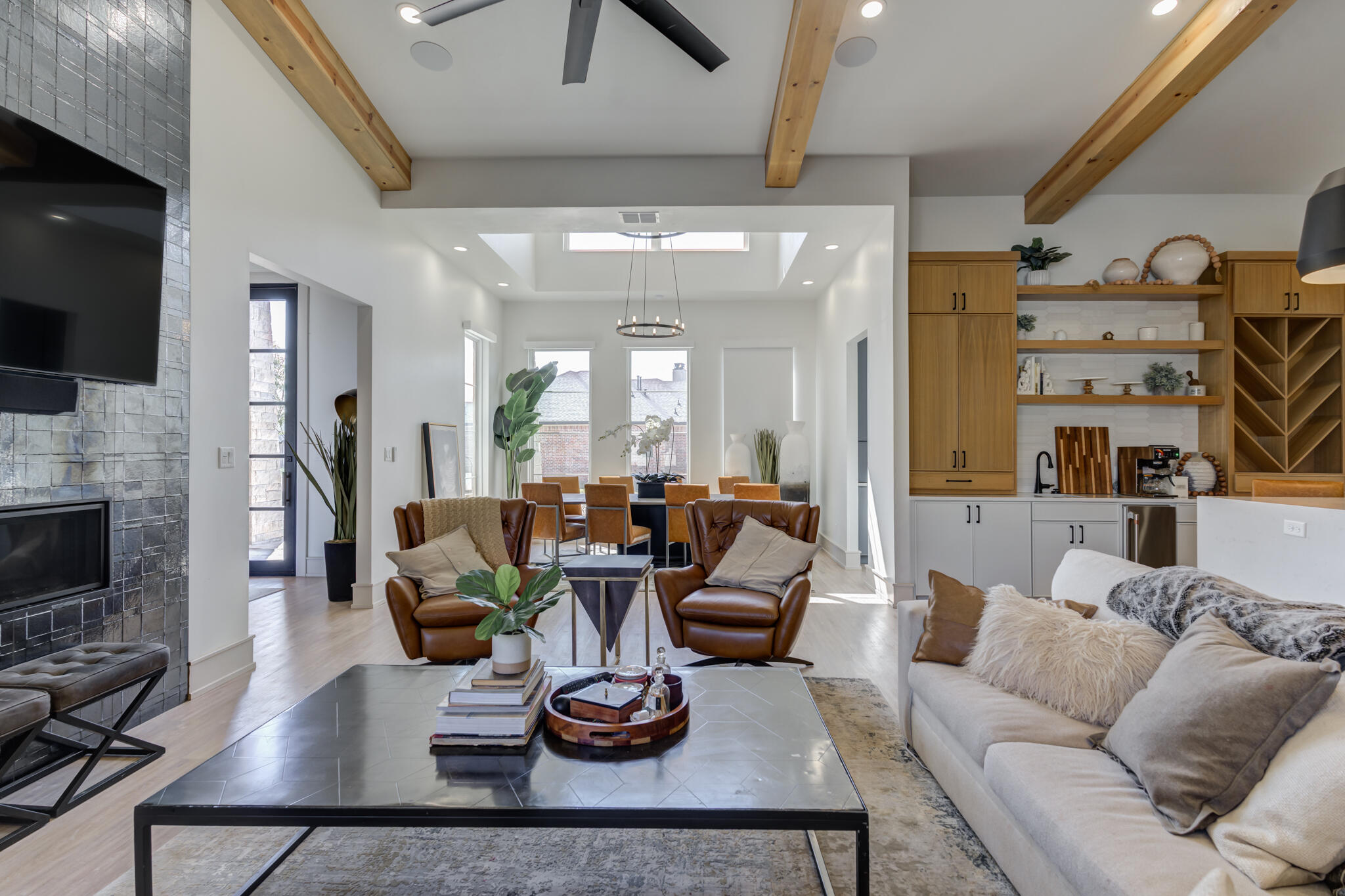 3940 148th Street Lubbock, TX 79423 - Photo 17 of 92 a living room with furniture kitchen view and a fireplace