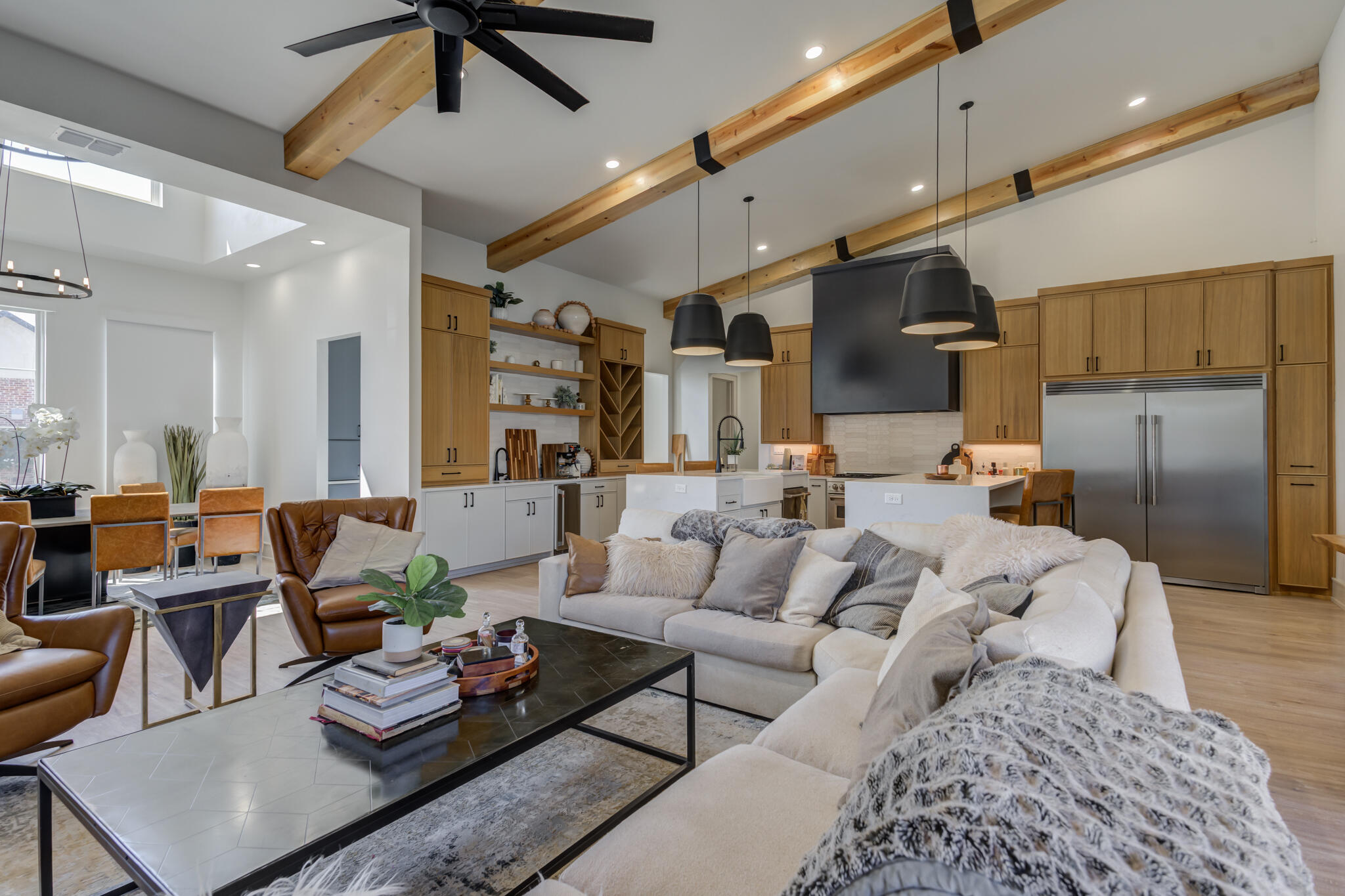 3940 148th Street Lubbock, TX 79423 - Photo 18 of 92 a living room with furniture kitchen view and a chandelier