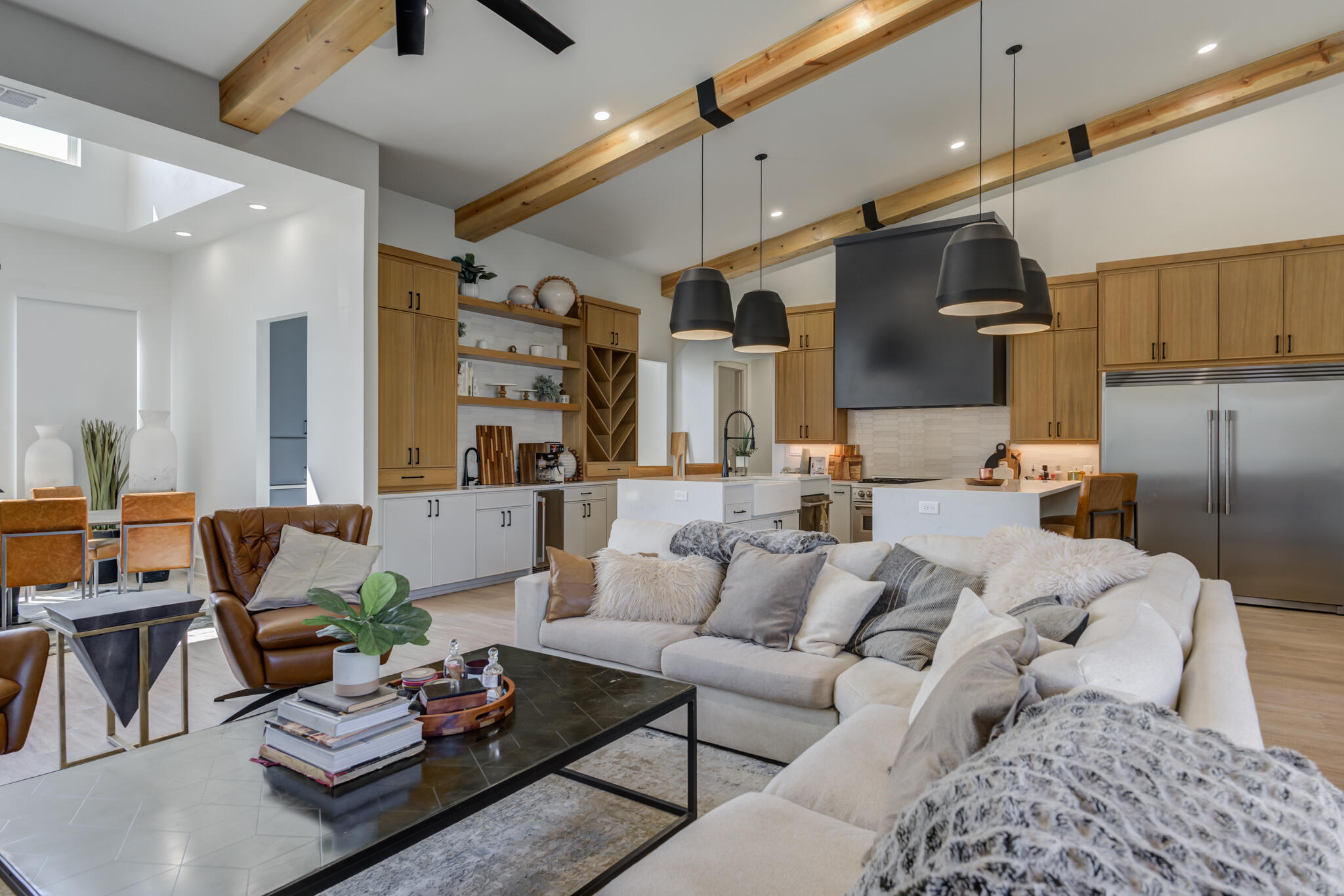 3940 148th Street Lubbock, TX 79423 - Photo 19 of 92 a living room with furniture kitchen view and a chandelier